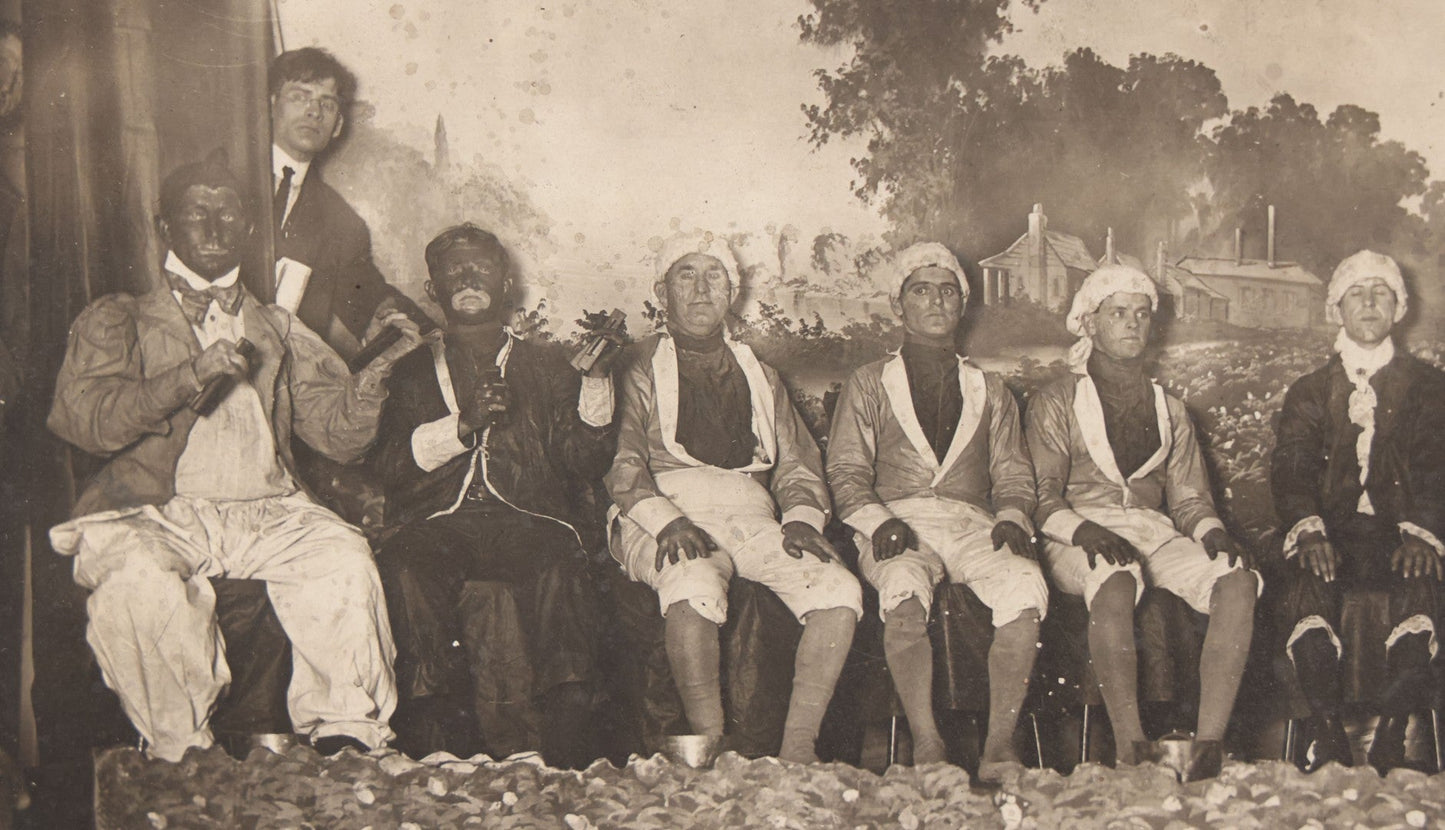 Lot 110 - Antique Boarded Photograph Of Stage Performers In Costume With Painted Backdrop And Drum Set, Music Stands In Foreground
