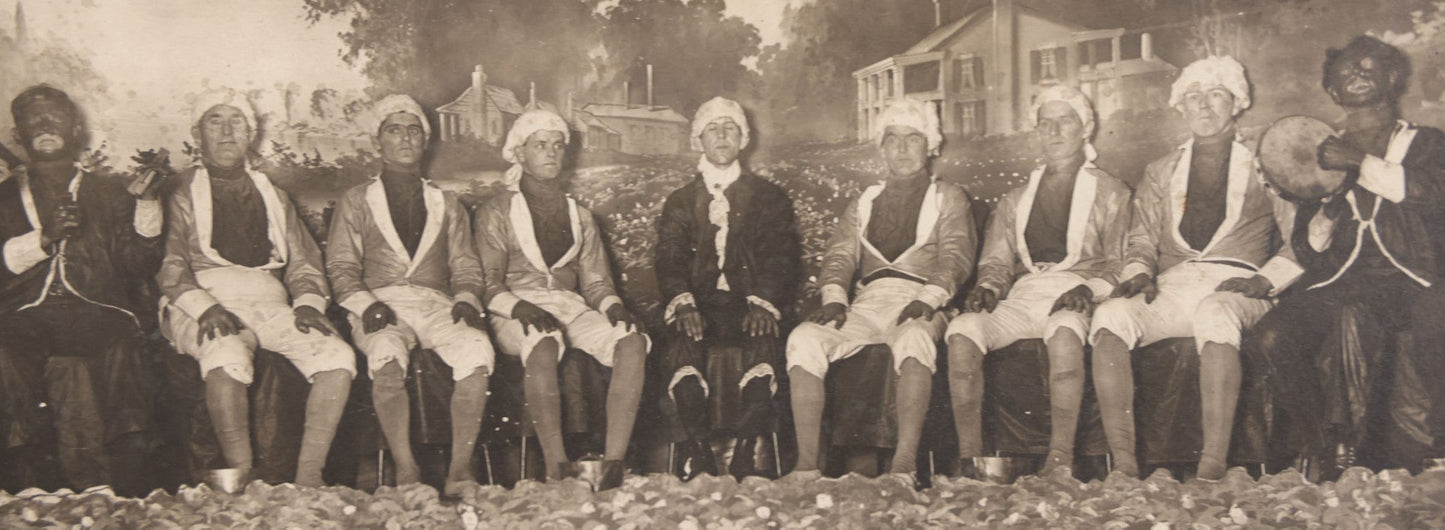 Lot 110 - Antique Boarded Photograph Of Stage Performers In Costume With Painted Backdrop And Drum Set, Music Stands In Foreground