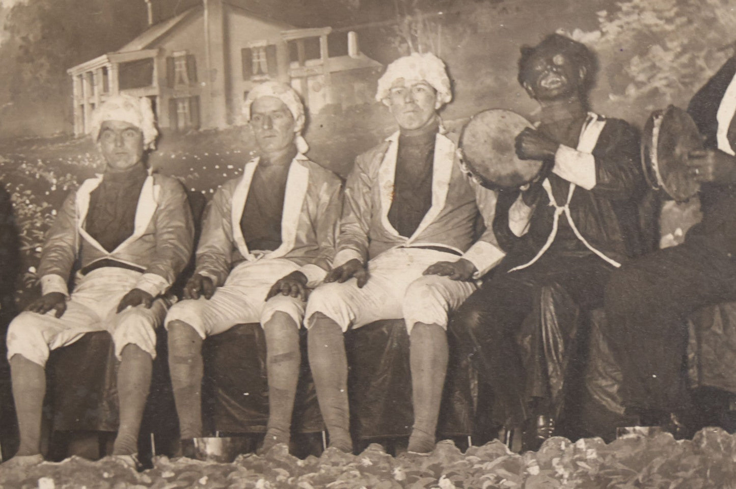 Lot 110 - Antique Boarded Photograph Of Stage Performers In Costume With Painted Backdrop And Drum Set, Music Stands In Foreground