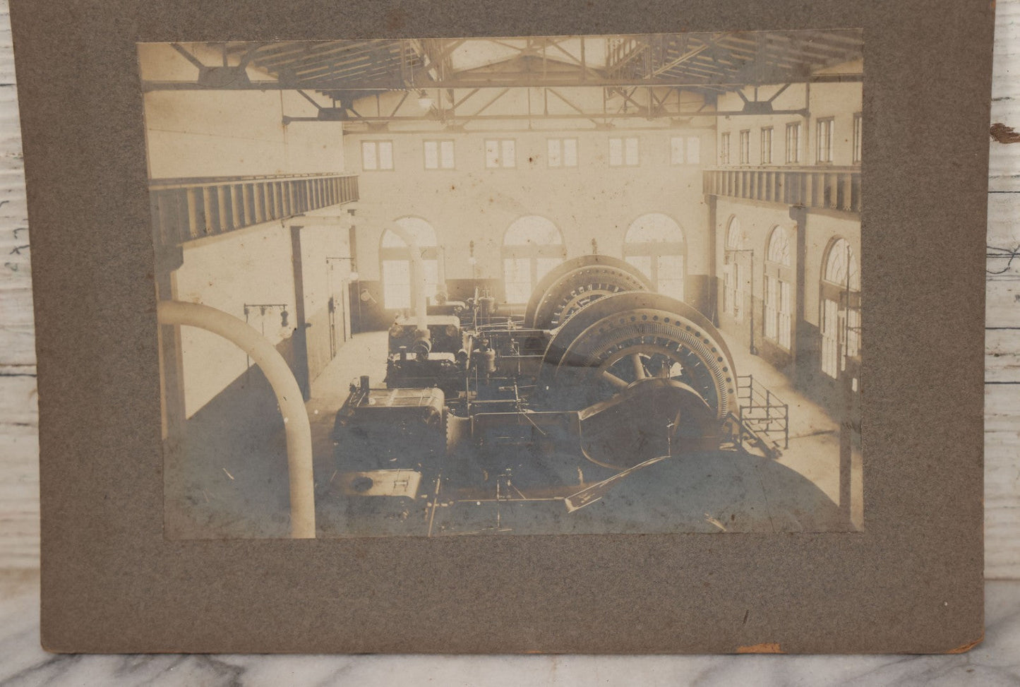 Lot 116 - Grouping Of Four Antique Photographs Of Massive Heavy Machinery In Room With Many Arched Windows