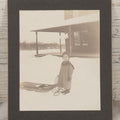 Lot 120 - Antique Boarded Photograph Of Young Boy Posing In Snow With Wooden Sled In Front Of Farmer's Porch