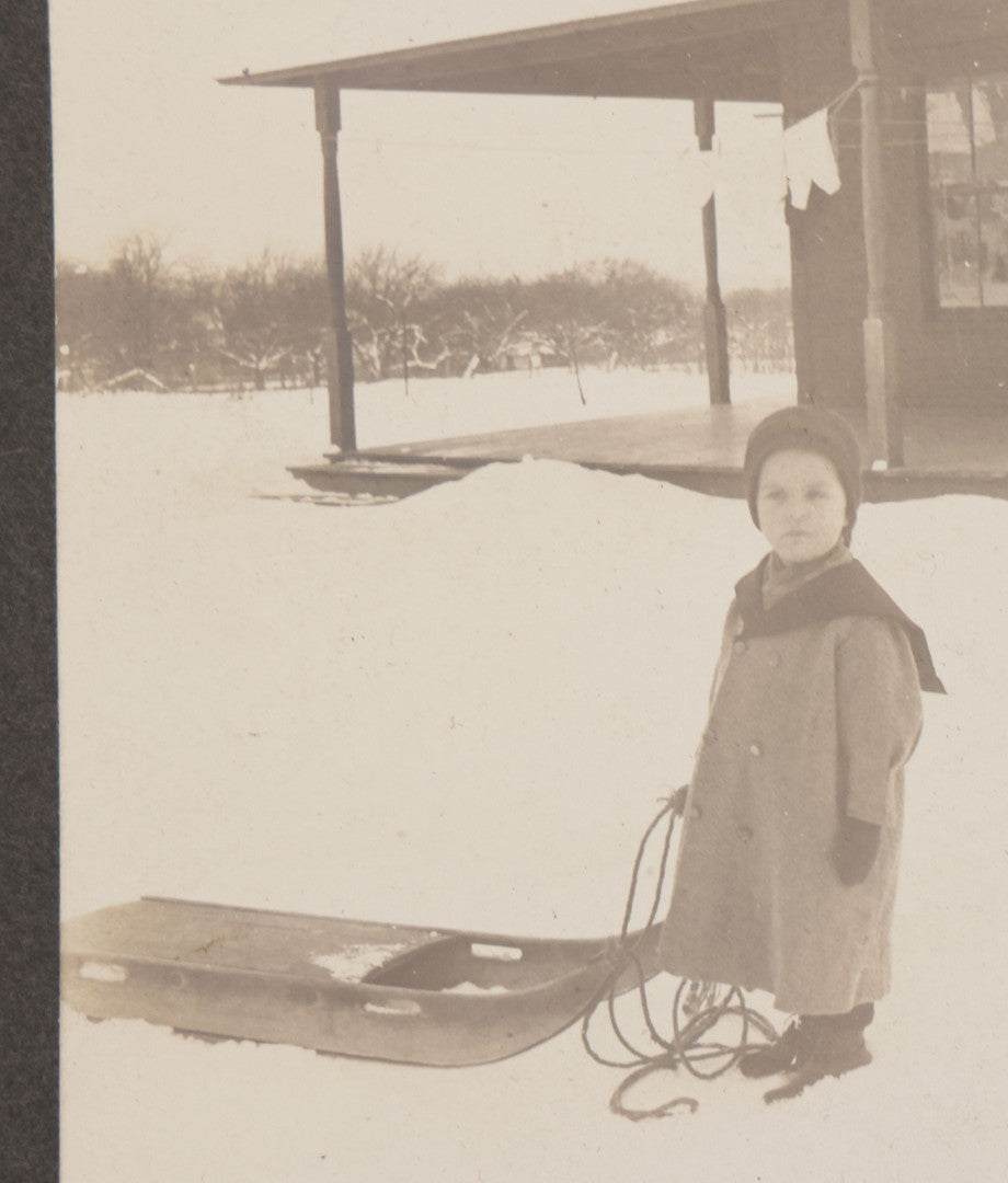 Lot 120 - Antique Boarded Photograph Of Young Boy Posing In Snow With Wooden Sled In Front Of Farmer's Porch