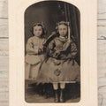Lot 127 - Single Antique Tintype Photograph Of Two Young Girls In Sunday Best Holding Small Pink Flower Bouquets