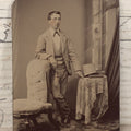 Lot 131 - Single Antique Tintype Photograph Of Confident Man Leaning On Chair Beside Table With Tophat And Book