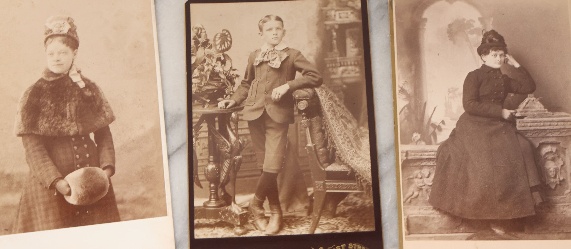 Lot 133 - Grouping Of 18 Antique Cabinet Card Photographs Including Pale Woman With Hand Muff, Friendly Man With Beard, Young Man With Bowler Cap And Swagger Stick, Boy Posing With Crane Table, And More