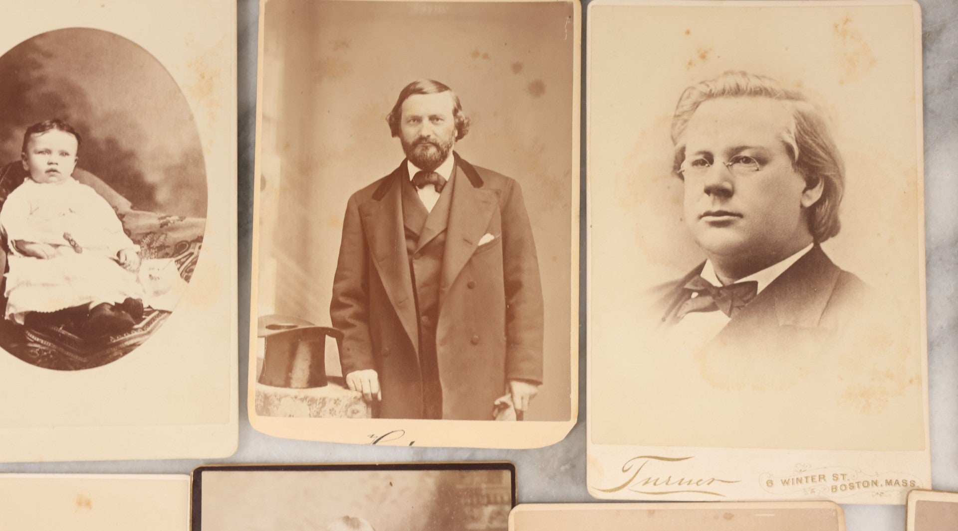 Lot 133 - Grouping Of 18 Antique Cabinet Card Photographs Including Pale Woman With Hand Muff, Friendly Man With Beard, Young Man With Bowler Cap And Swagger Stick, Boy Posing With Crane Table, And More