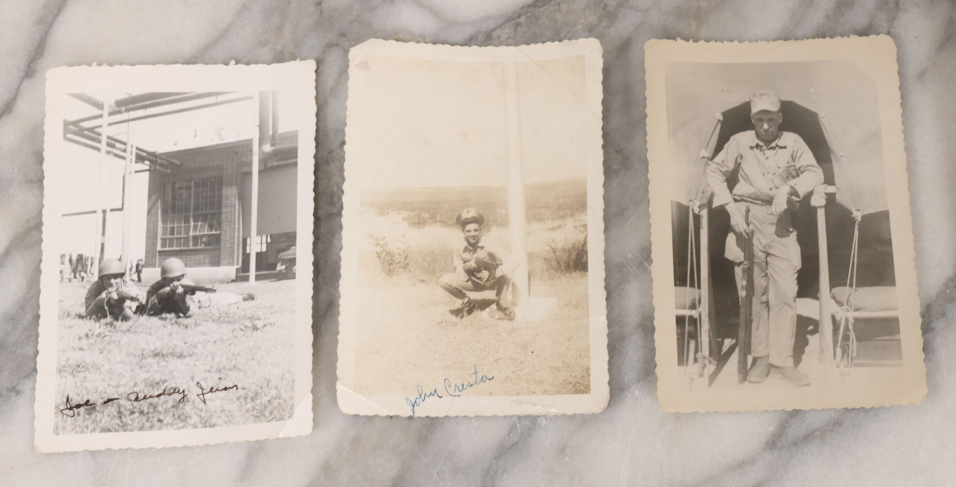 Lot 137 - Grouping Of 16 Post WWII Era Vintage Snapshot Photographs Of Soldiers Posing With Rifles, Goofing Off, And One Of Soldier Kissing His Lady