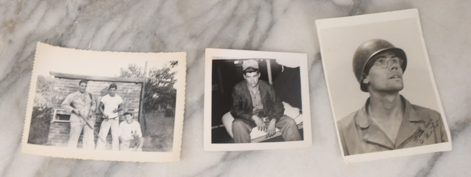 Lot 137 - Grouping Of 16 Post WWII Era Vintage Snapshot Photographs Of Soldiers Posing With Rifles, Goofing Off, And One Of Soldier Kissing His Lady