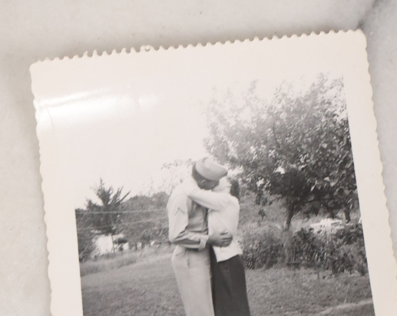 Lot 137 - Grouping Of 16 Post WWII Era Vintage Snapshot Photographs Of Soldiers Posing With Rifles, Goofing Off, And One Of Soldier Kissing His Lady
