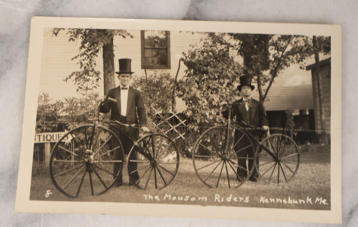Lot 139 - Grouping Of 25 Vintage Snapshot Vernacular Photographs Including Girls On Motorcycle With Sidecar, Men In Tophats Posing With Bicycles, Man Flipping Off Camera, And More