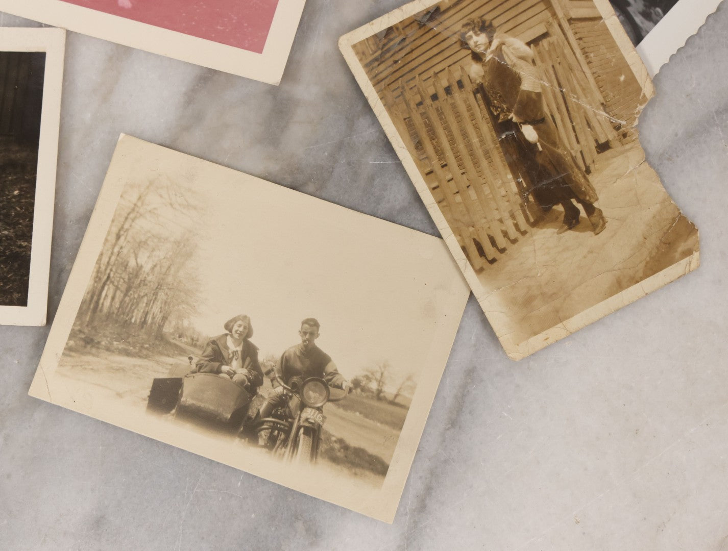 Lot 139 - Grouping Of 25 Vintage Snapshot Vernacular Photographs Including Girls On Motorcycle With Sidecar, Men In Tophats Posing With Bicycles, Man Flipping Off Camera, And More