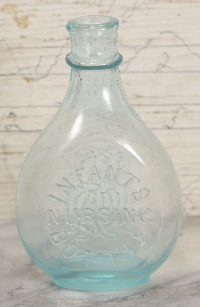 Lot 031 - Antique Clear Glass Infants Nursing Bottle With I.N.B. Monogram, 5-1/2" Height
