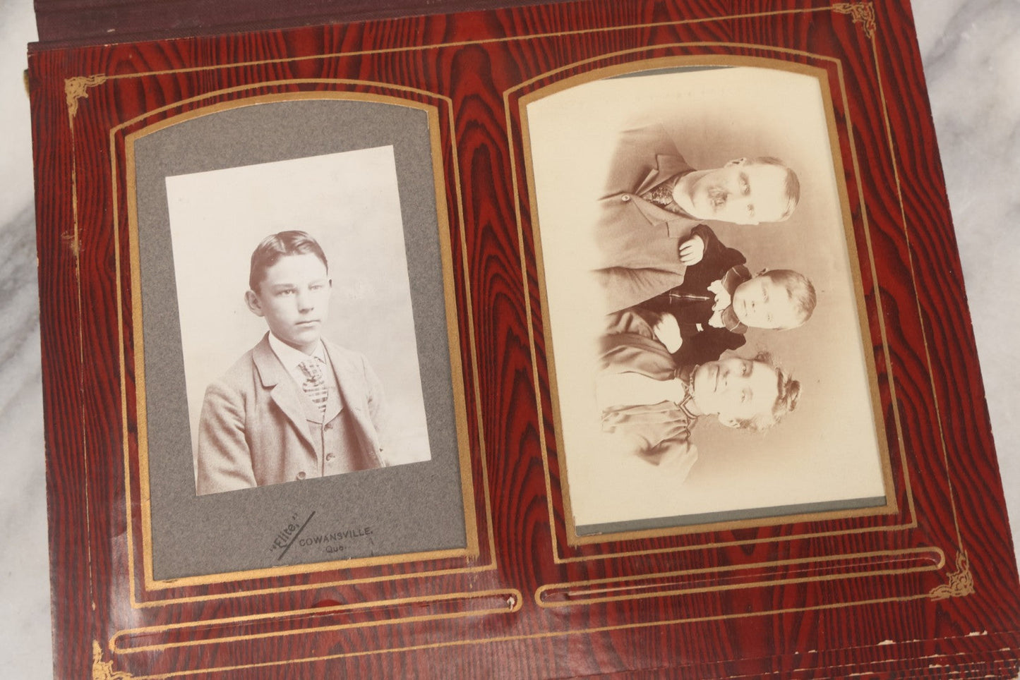 Lot 061 - Antique Victorian Photo Album With Tin Cover And Pressed Brass Anchor "Hope" Motif With Worn Beveled Glass Mirror, And Green Velvet Backing Containing 40+ Cabinet Card And Other Photographs