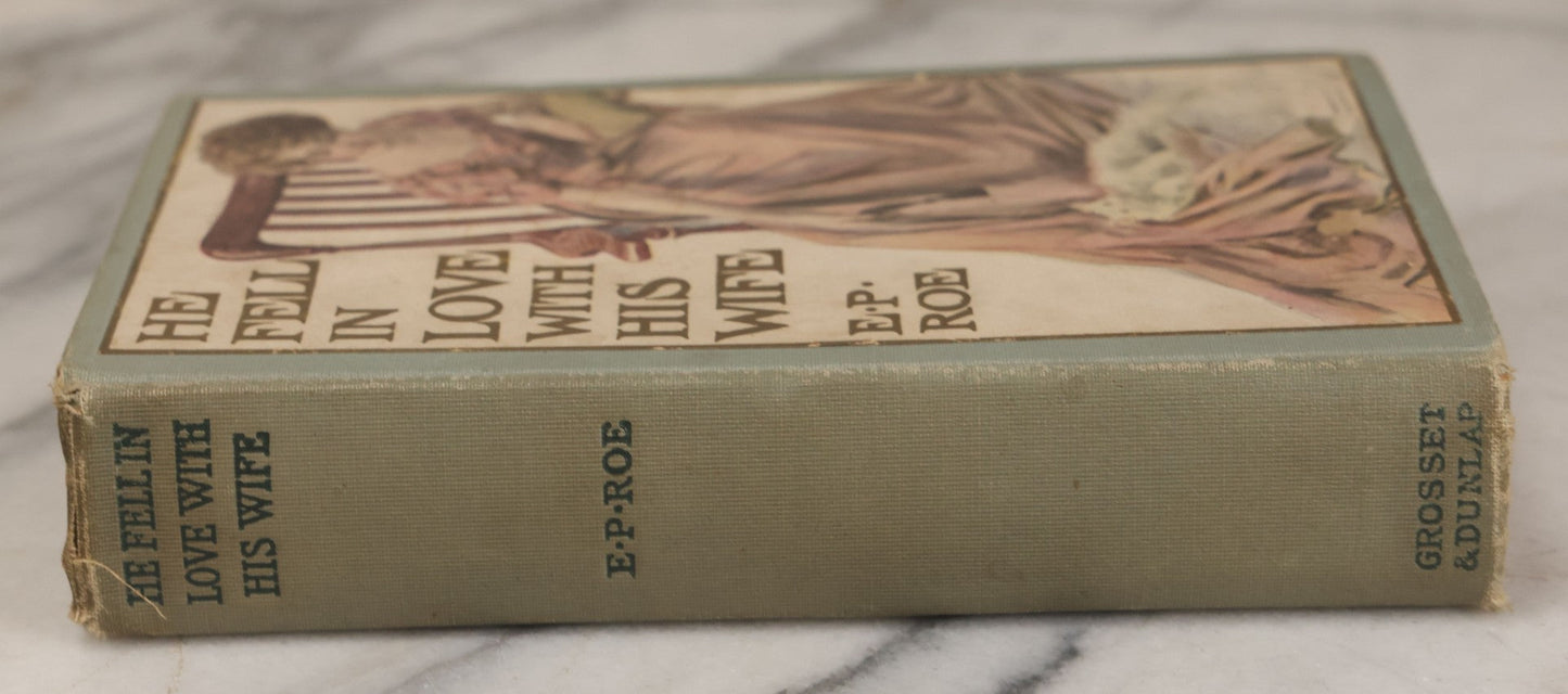 Lot 110 - "He Fell In Love With His Wife" Antique Romance Novel By Edward P. Roe, With Cover Art Of Woman Playing With Fluffy White Cat, Illustrated By Z.P. Nikolaki, Grosset & Dunlap, Publishers, New York, Copyright 1911, By Dodd, Mead & Co.
