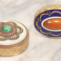 Lot 045 - Pair Of Vintage French Brass Pill Boxes With Decorative Covers Featuring Enamel And Stone Embellishments, With Interior Beveled Mirrors