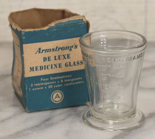 Lot 049 - Vintage Armstrong's De Luxe Medicine Glass One Ounce Dosage Measuring Cup In Box, Drug Sundries Department, Armstrong Cork Co., Lancaster, Pennsylvania