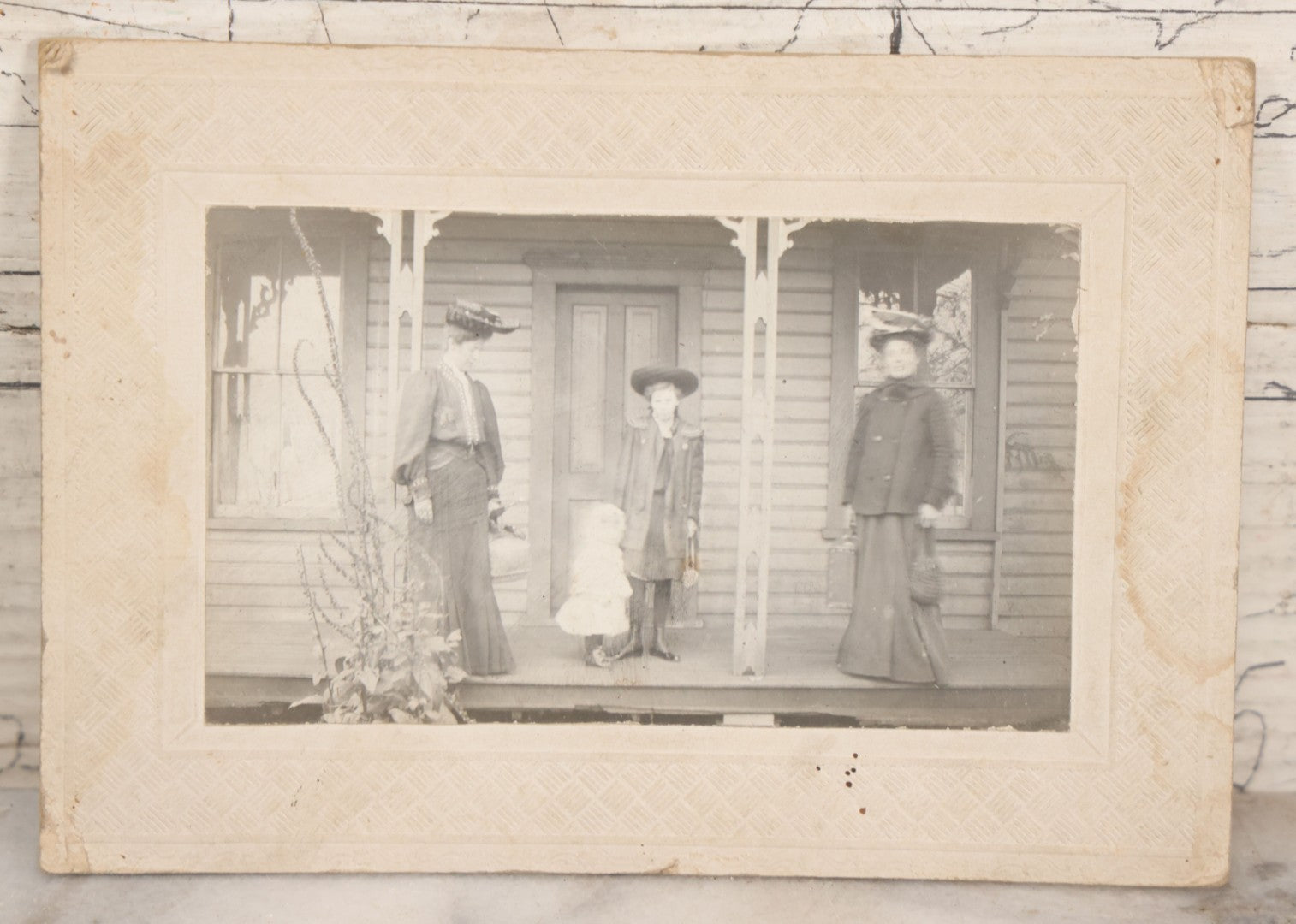 Lot 081 - Five Piece Antique Boarded Photography Grouping Including Woman Posing With Her Home, Two Children On Wicker Chair, Portraits Of Ladies, And Family Standing On Porch