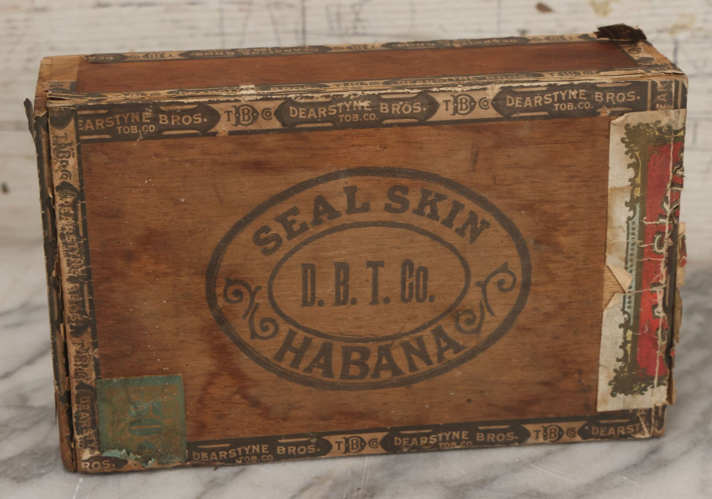 Lot 115 - Antique Wooden Cigar Box For "Seal Skin" Cigars, Manufactured By Dearstyne Bros. Tobacco Co., Albany, New York, With Lithographed Interior And Exterior Labels With Arctic Seal Graphics