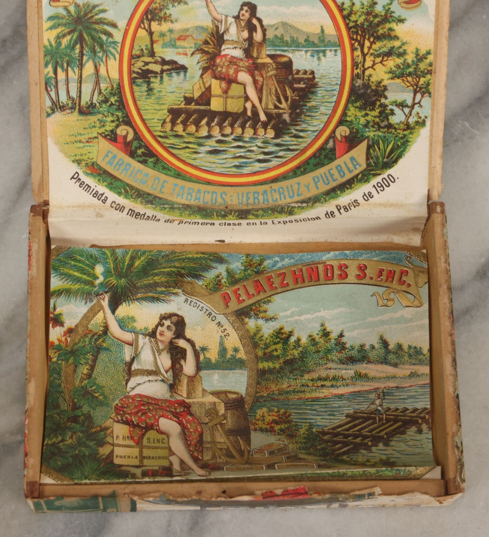 Lot 116 - Antique Wooden Cigar Box For "La Balsa" Cigars, Manufactured By Peláez Hermanos Sociedad En Comandita, Veracruz And Puebla, Mexico., With Lithographed Interior And Exterior Labels With Pretty Woman Smoking On Raft Graphics