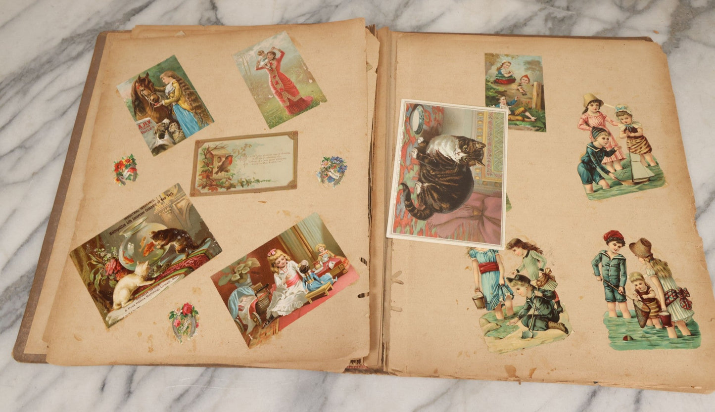 Lot 119 - Antique Victorian Scrapbook Album Cover With Playing Cards And Dogs Graphics, With Many Lithographed Trade Cards, Holiday Cards, And Die Cuts, 100+ Pieces