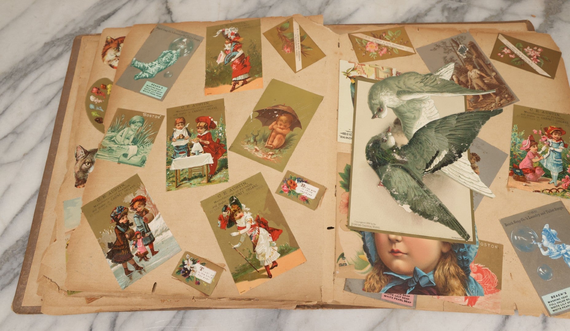 Lot 119 - Antique Victorian Scrapbook Album Cover With Playing Cards And Dogs Graphics, With Many Lithographed Trade Cards, Holiday Cards, And Die Cuts, 100+ Pieces