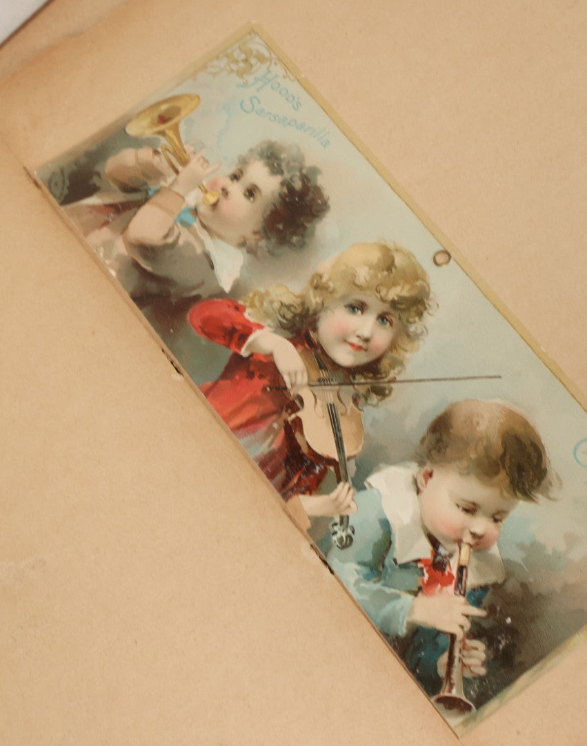 Lot 119 - Antique Victorian Scrapbook Album Cover With Playing Cards And Dogs Graphics, With Many Lithographed Trade Cards, Holiday Cards, And Die Cuts, 100+ Pieces