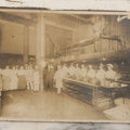 Lot 124 - Antique Boarded Occupational Photograph Of Kitchen Staff At Their Stations In Large Industrial Kitchen With Period Uniforms And Cooking Appliances Visible