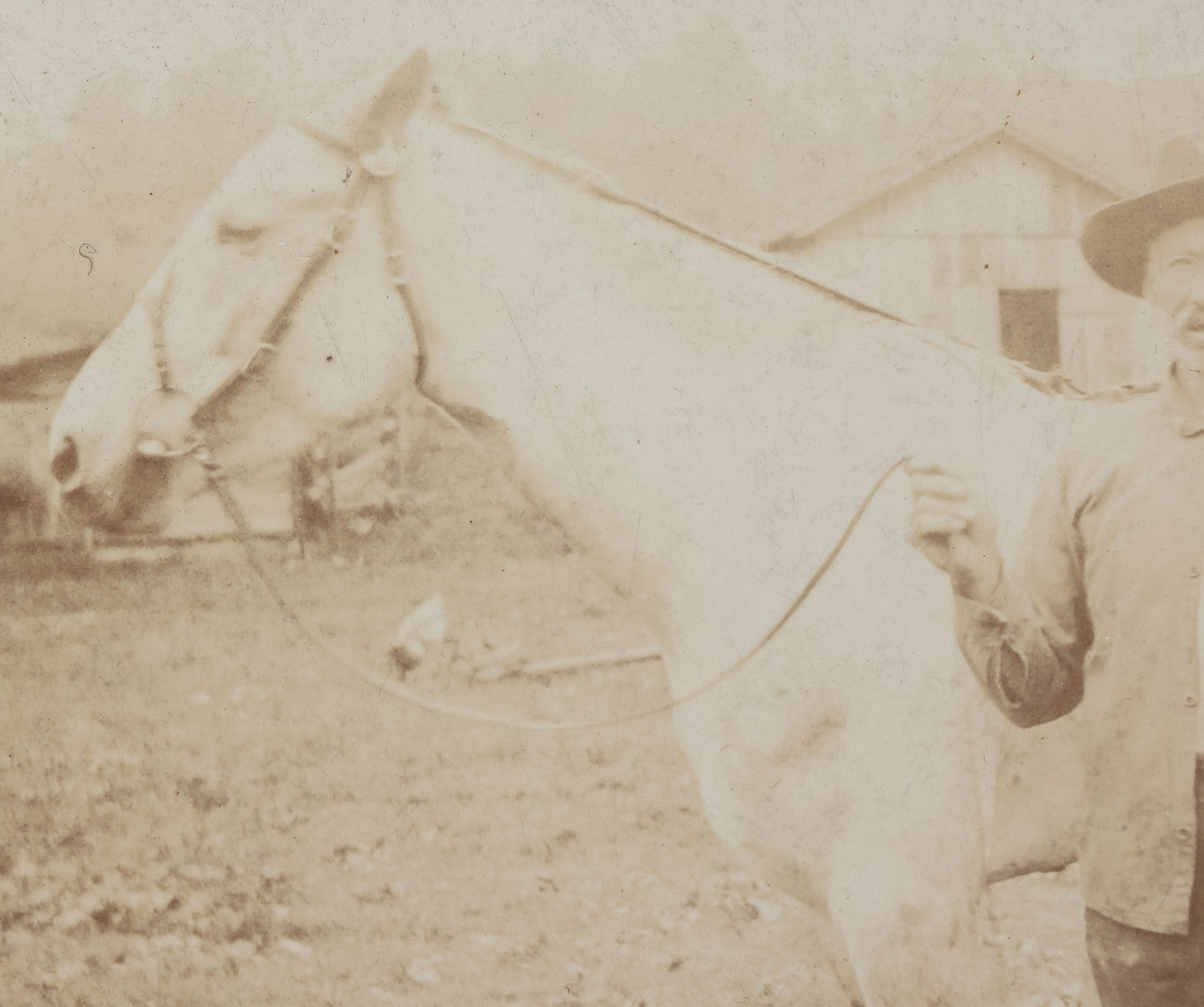 Lot 128 - Antique Boarded Photograph Of An Elderly Cowboy Smoking A Pipe Beside His White Horse