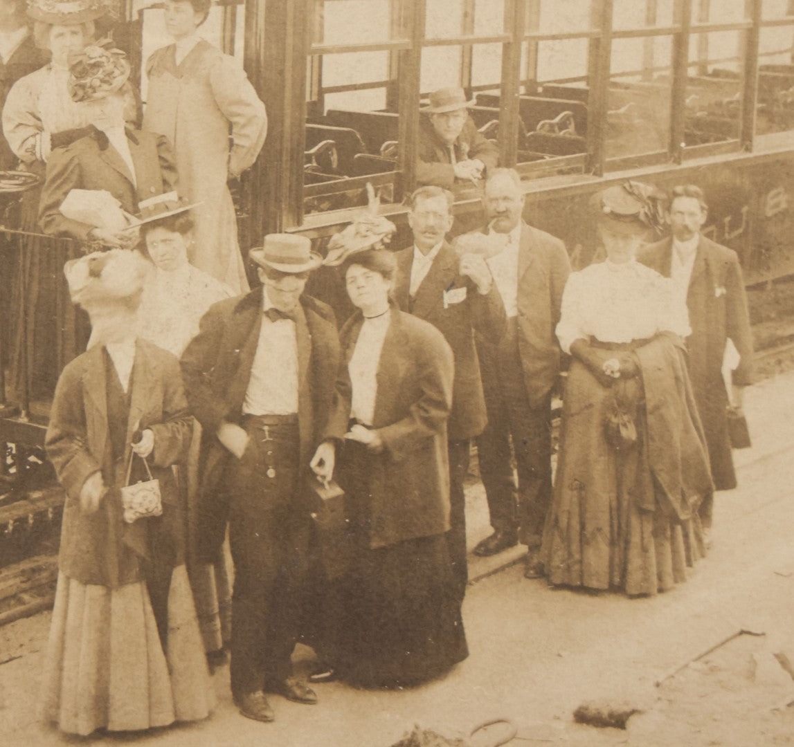 Lot 129 - Antique Boarded Souvenir Photograph Of Travelers Beside Rail Car On The Manitou & Pike's Peak Cog Railway, Rocky Mountains, Colorado, Photo By J.G. Hiestand, Official Photographer, Dated 1907