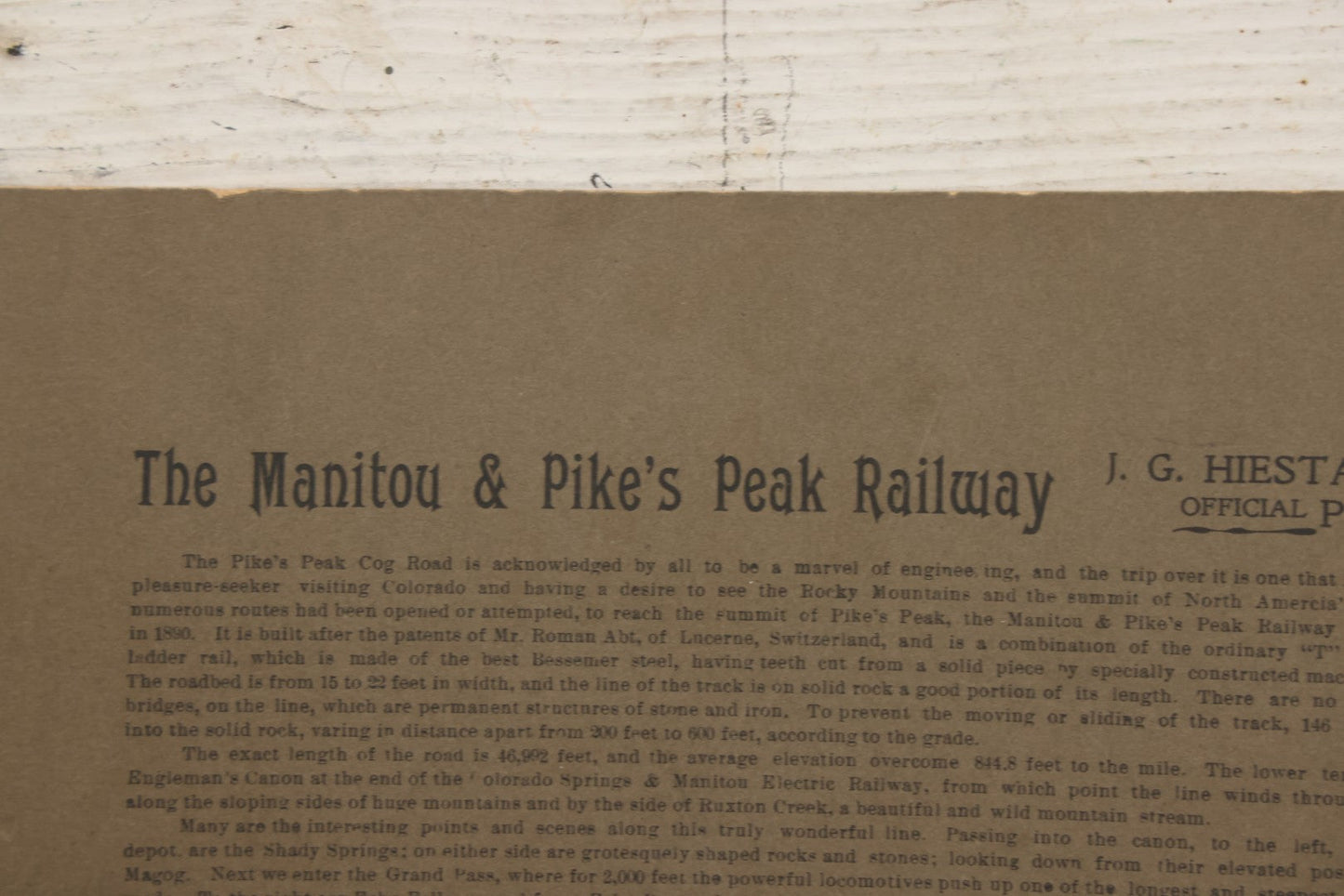 Lot 129 - Antique Boarded Souvenir Photograph Of Travelers Beside Rail Car On The Manitou & Pike's Peak Cog Railway, Rocky Mountains, Colorado, Photo By J.G. Hiestand, Official Photographer, Dated 1907