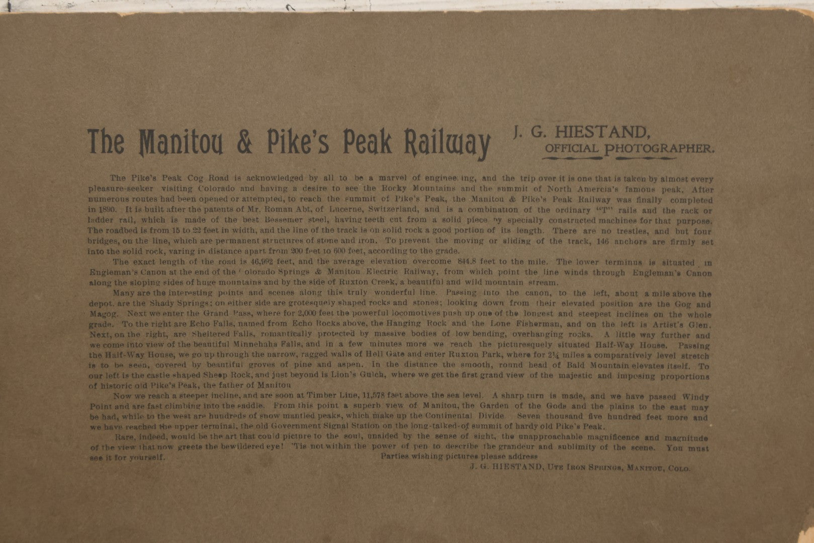 Lot 129 - Antique Boarded Souvenir Photograph Of Travelers Beside Rail Car On The Manitou & Pike's Peak Cog Railway, Rocky Mountains, Colorado, Photo By J.G. Hiestand, Official Photographer, Dated 1907