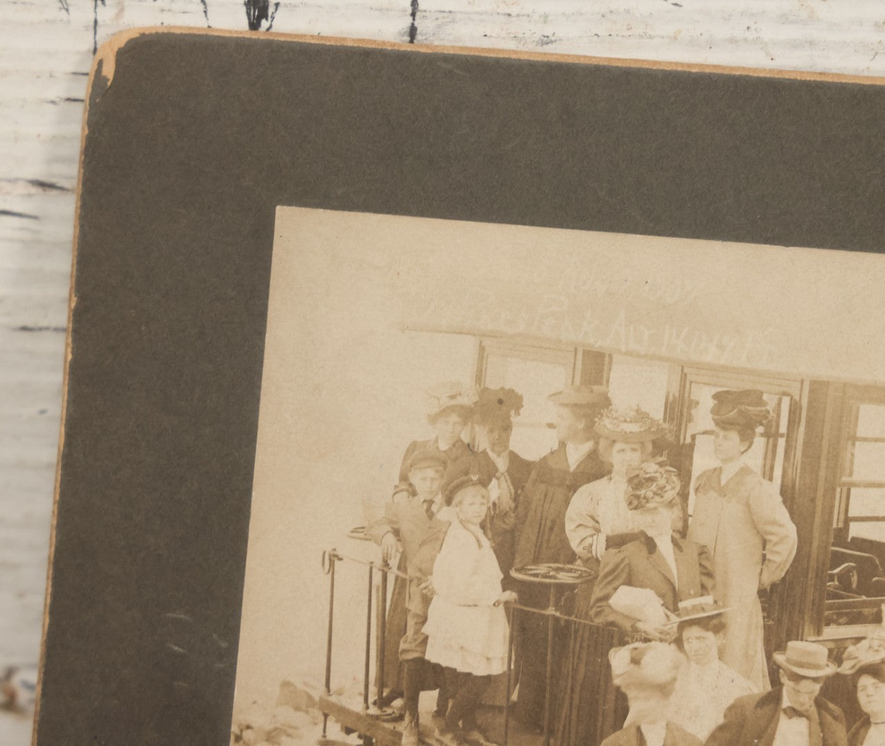 Lot 129 - Antique Boarded Souvenir Photograph Of Travelers Beside Rail Car On The Manitou & Pike's Peak Cog Railway, Rocky Mountains, Colorado, Photo By J.G. Hiestand, Official Photographer, Dated 1907