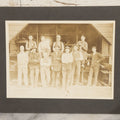 Lot 131 - Antique Boarded Occupational Photograph Of Lumber Mill Workers, Including Their Shop Dog, Posing Before Dimensional Lumber Inventory