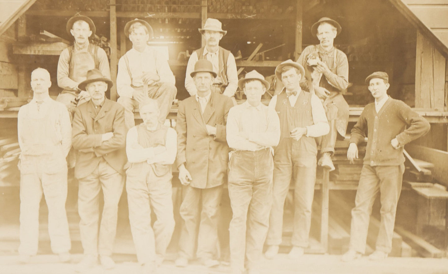 Lot 131 - Antique Boarded Occupational Photograph Of Lumber Mill Workers, Including Their Shop Dog, Posing Before Dimensional Lumber Inventory