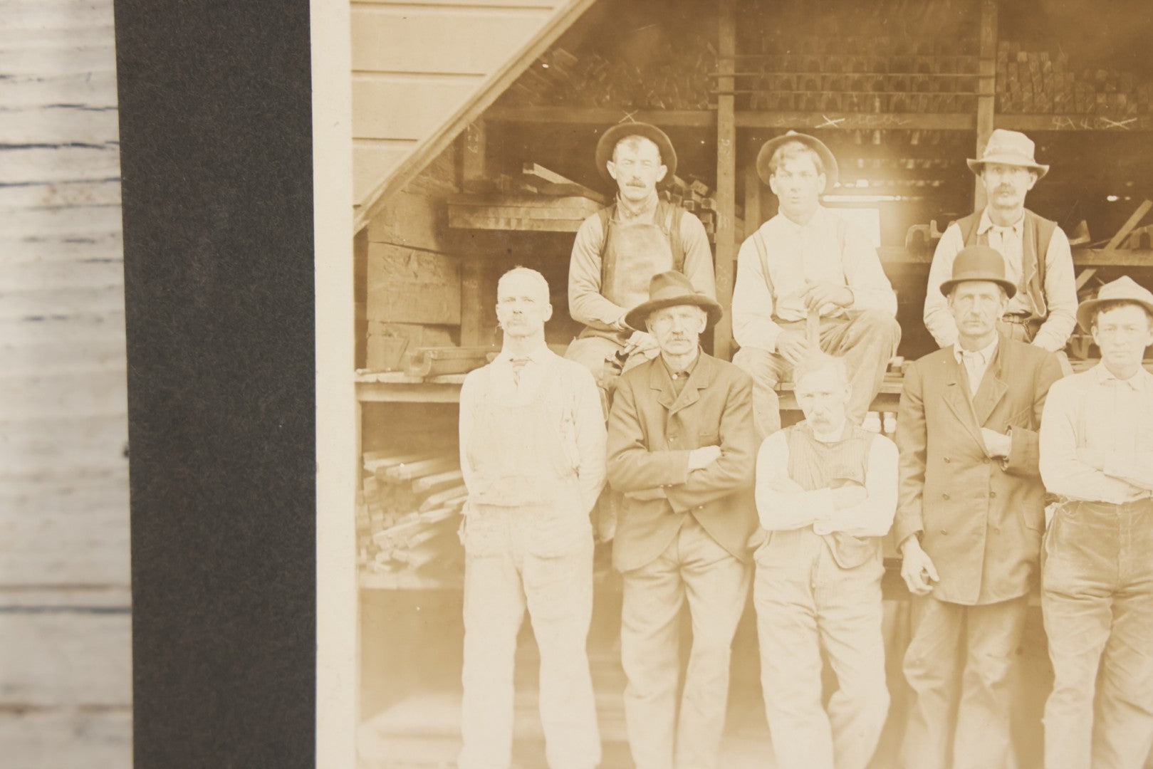 Lot 131 - Antique Boarded Occupational Photograph Of Lumber Mill Workers, Including Their Shop Dog, Posing Before Dimensional Lumber Inventory