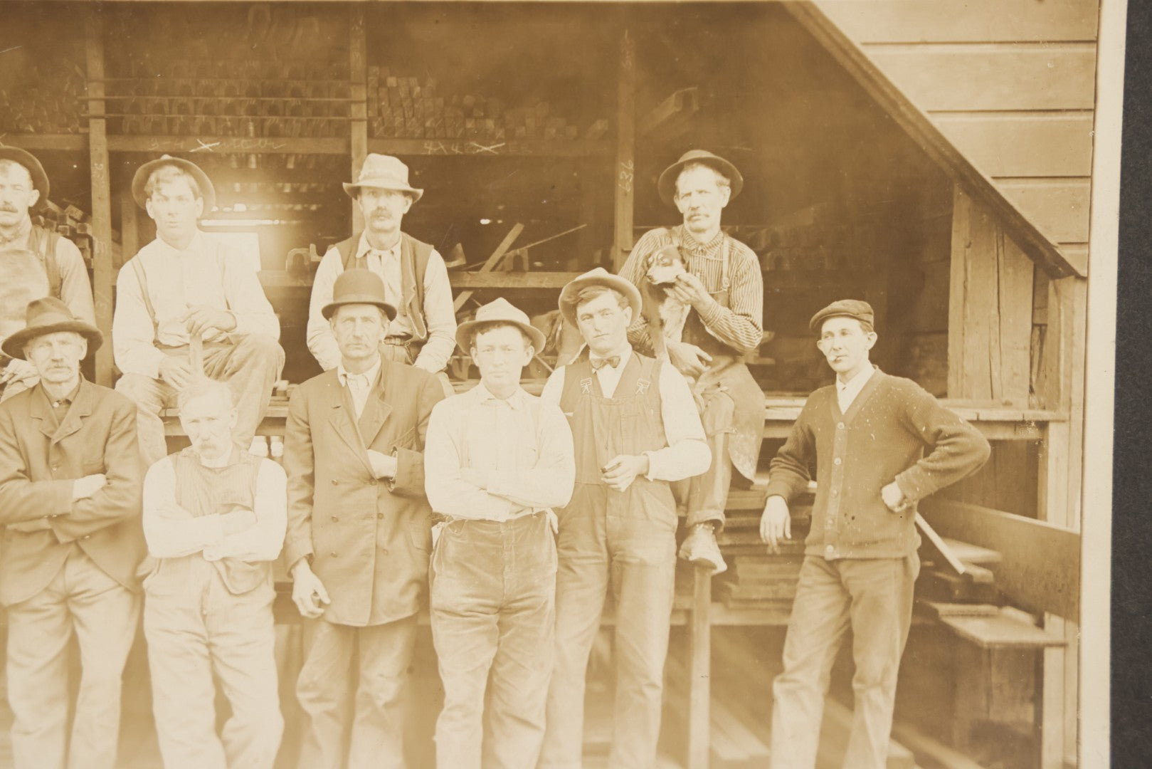 Lot 131 - Antique Boarded Occupational Photograph Of Lumber Mill Workers, Including Their Shop Dog, Posing Before Dimensional Lumber Inventory