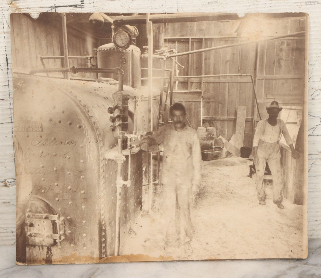 Lot 134 - Antique Boarded Occupational Photograph Of Two Filthy Workers Tending To An Industrial Boiler, Faint Pen Writing Indicates Date Of 1901-1902 And Other Information