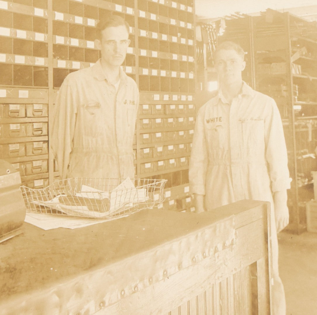 Lot 135 - Antique Boarded Occupational Photograph Of Two Workers In Embroidered Coveralls Working In A Parts Shop 