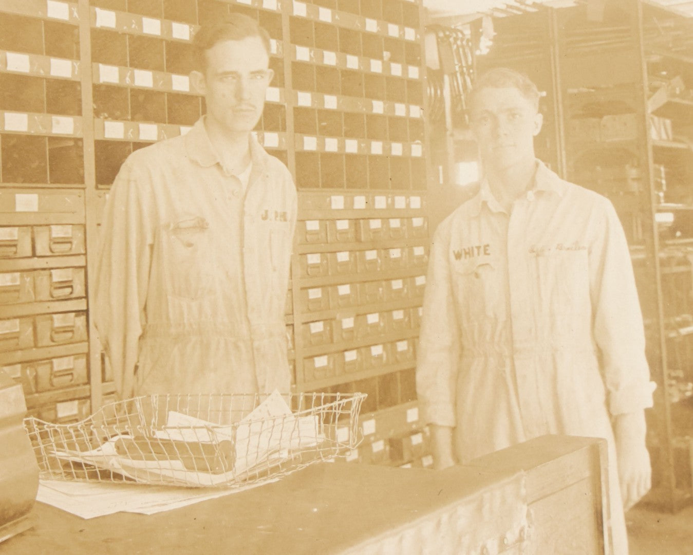 Lot 135 - Antique Boarded Occupational Photograph Of Two Workers In Embroidered Coveralls Working In A Parts Shop 