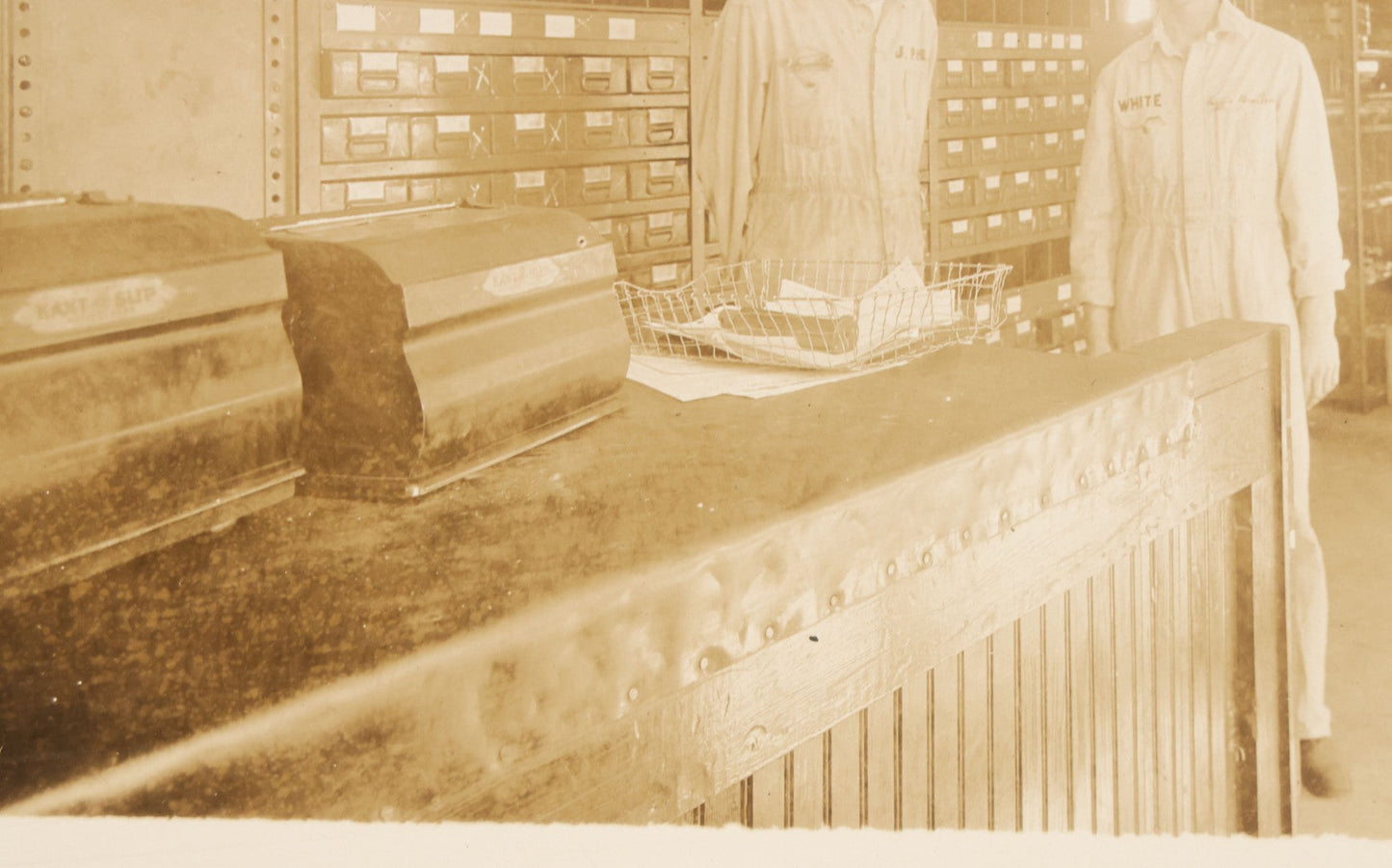 Lot 135 - Antique Boarded Occupational Photograph Of Two Workers In Embroidered Coveralls Working In A Parts Shop 