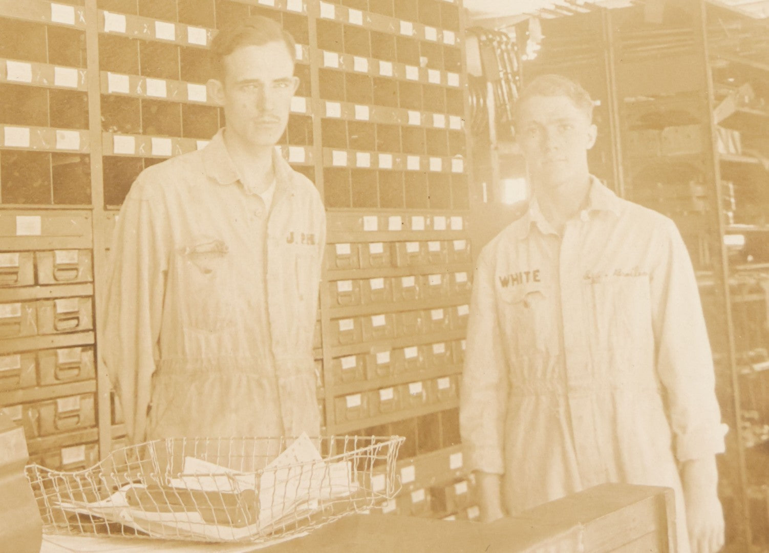Lot 135 - Antique Boarded Occupational Photograph Of Two Workers In Embroidered Coveralls Working In A Parts Shop 