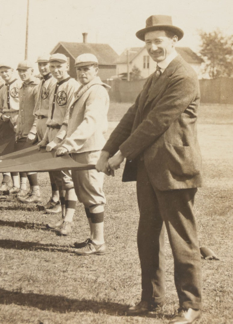 Lot 139 - Antique Boarded Photograph Of The Players Of A Baseball Team In Uniform Posing With A Large Flag, Uniforms Say "Royal League" With Patches Visible