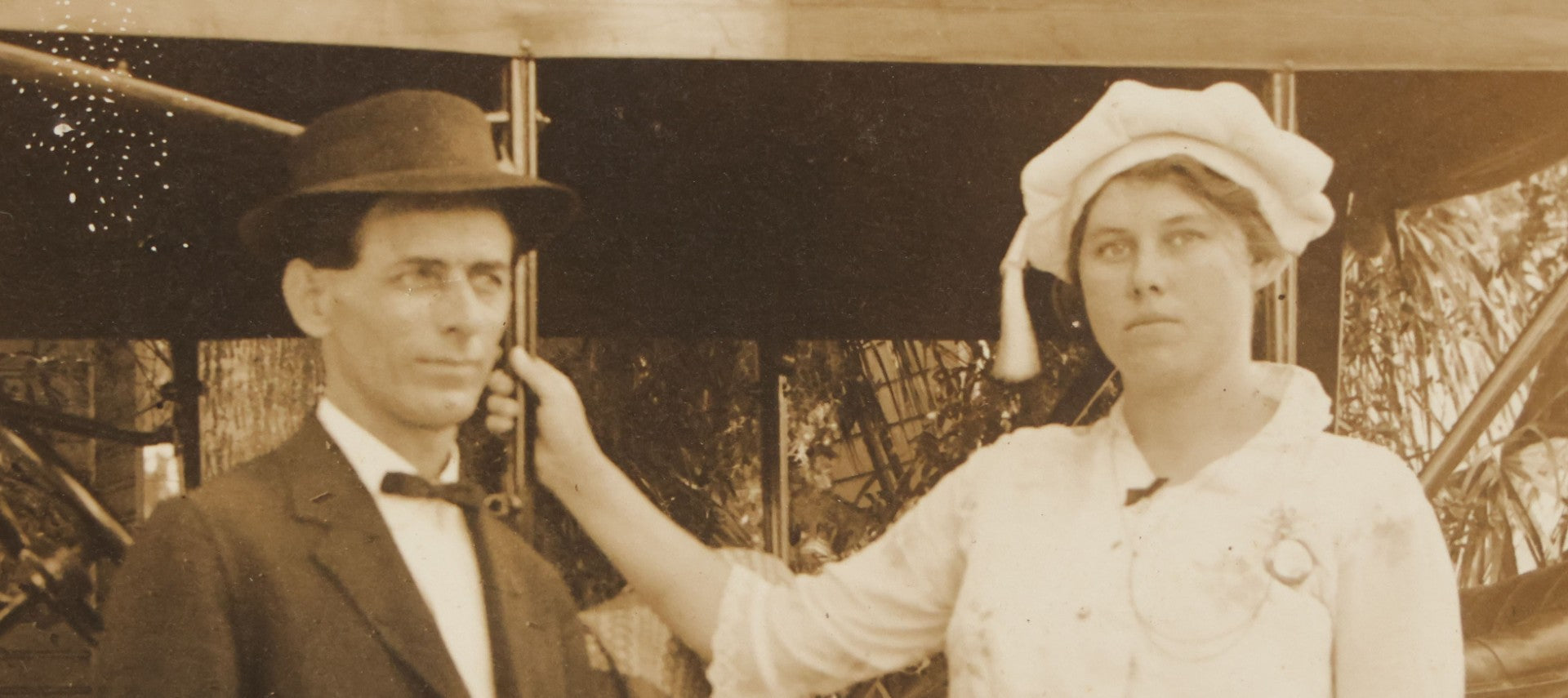 Lot 141 - Pair Of Antique Boarded Photographs Including Man And Woman Couple Posing Beside Early Automobile, Woman Does Not Look Thrilled And Man Seems To Know It, And Man Driving Away Without Her