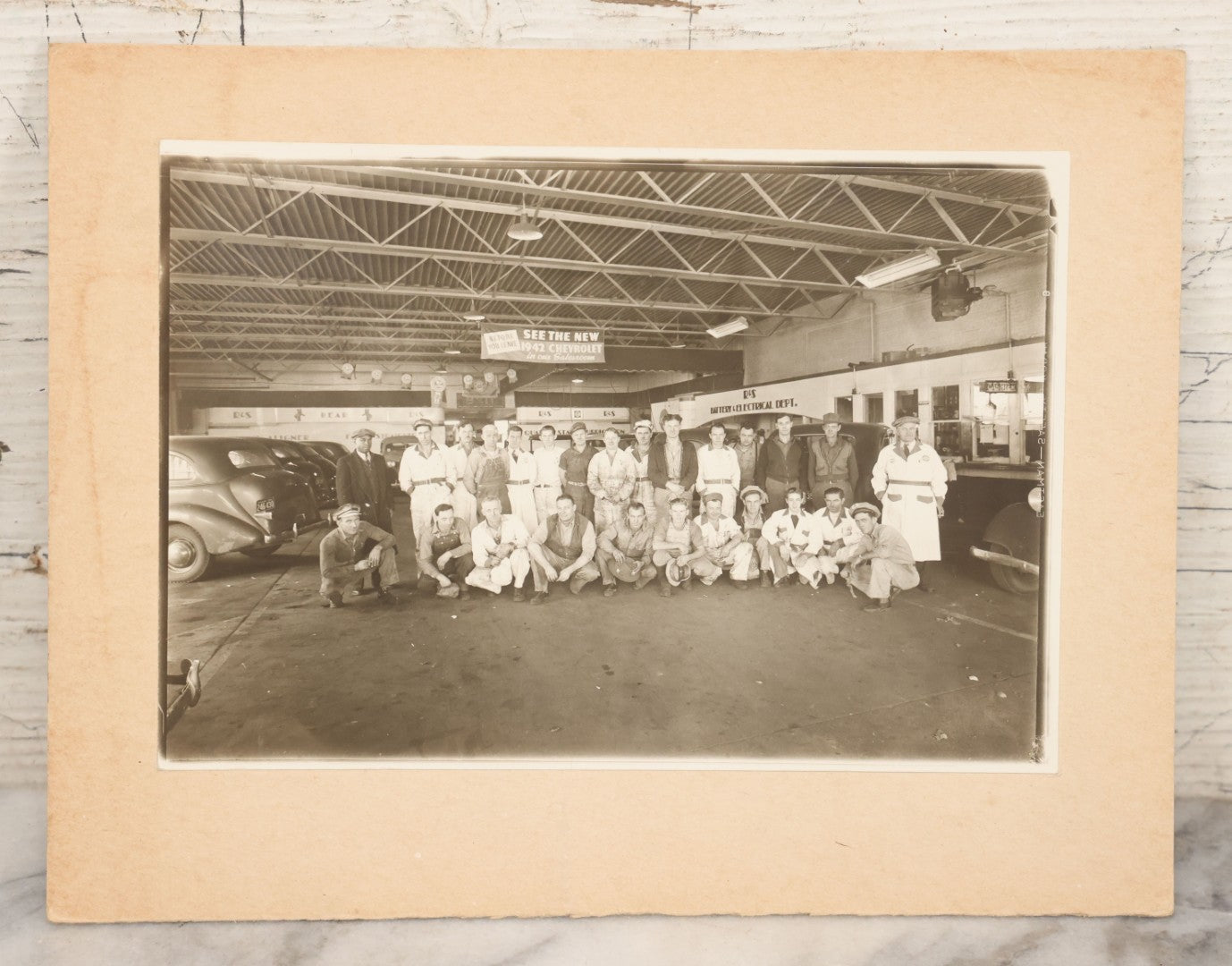 Lot 145 - Vintage Boarded Occupational Photograph Of Mechanics And Workers At A Chevrolet Dealership And Sales Room, Photo Taken On November 13, 1941, Photographed On Eastman Kodak Safety Film