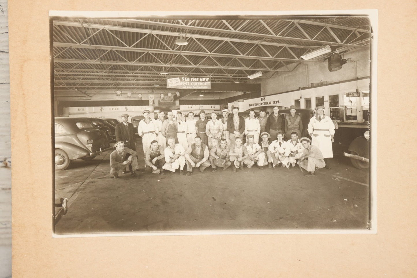 Lot 145 - Vintage Boarded Occupational Photograph Of Mechanics And Workers At A Chevrolet Dealership And Sales Room, Photo Taken On November 13, 1941, Photographed On Eastman Kodak Safety Film