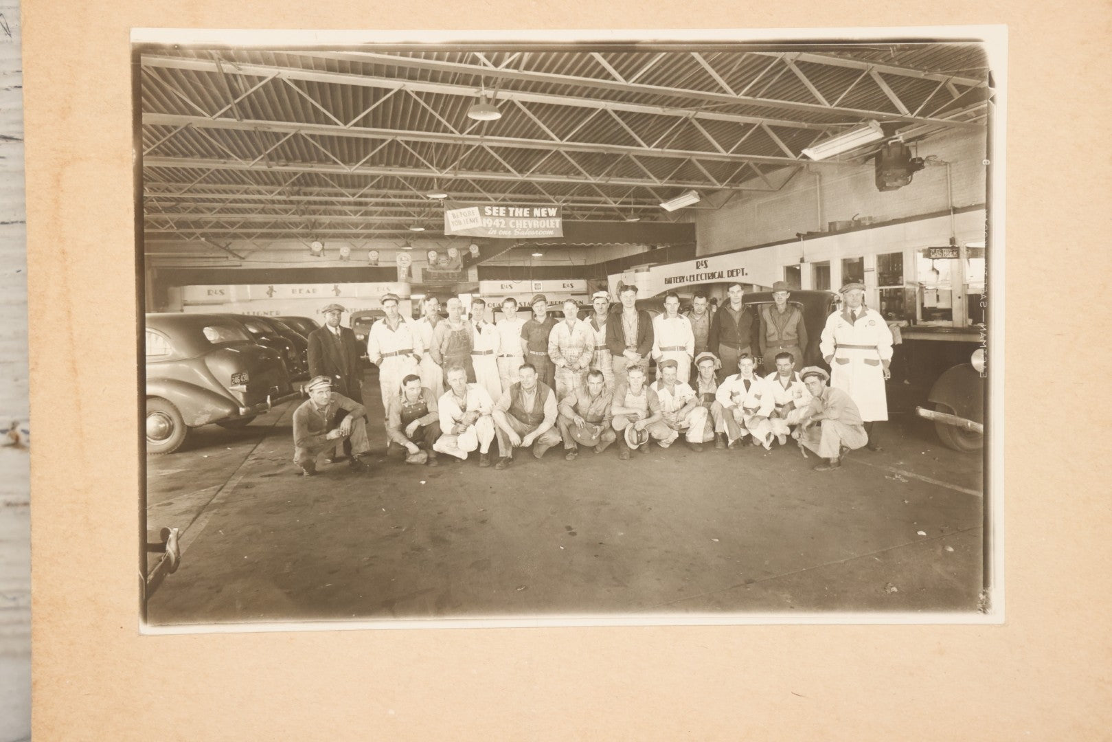 Lot 145 - Vintage Boarded Occupational Photograph Of Mechanics And Workers At A Chevrolet Dealership And Sales Room, Photo Taken On November 13, 1941, Photographed On Eastman Kodak Safety Film