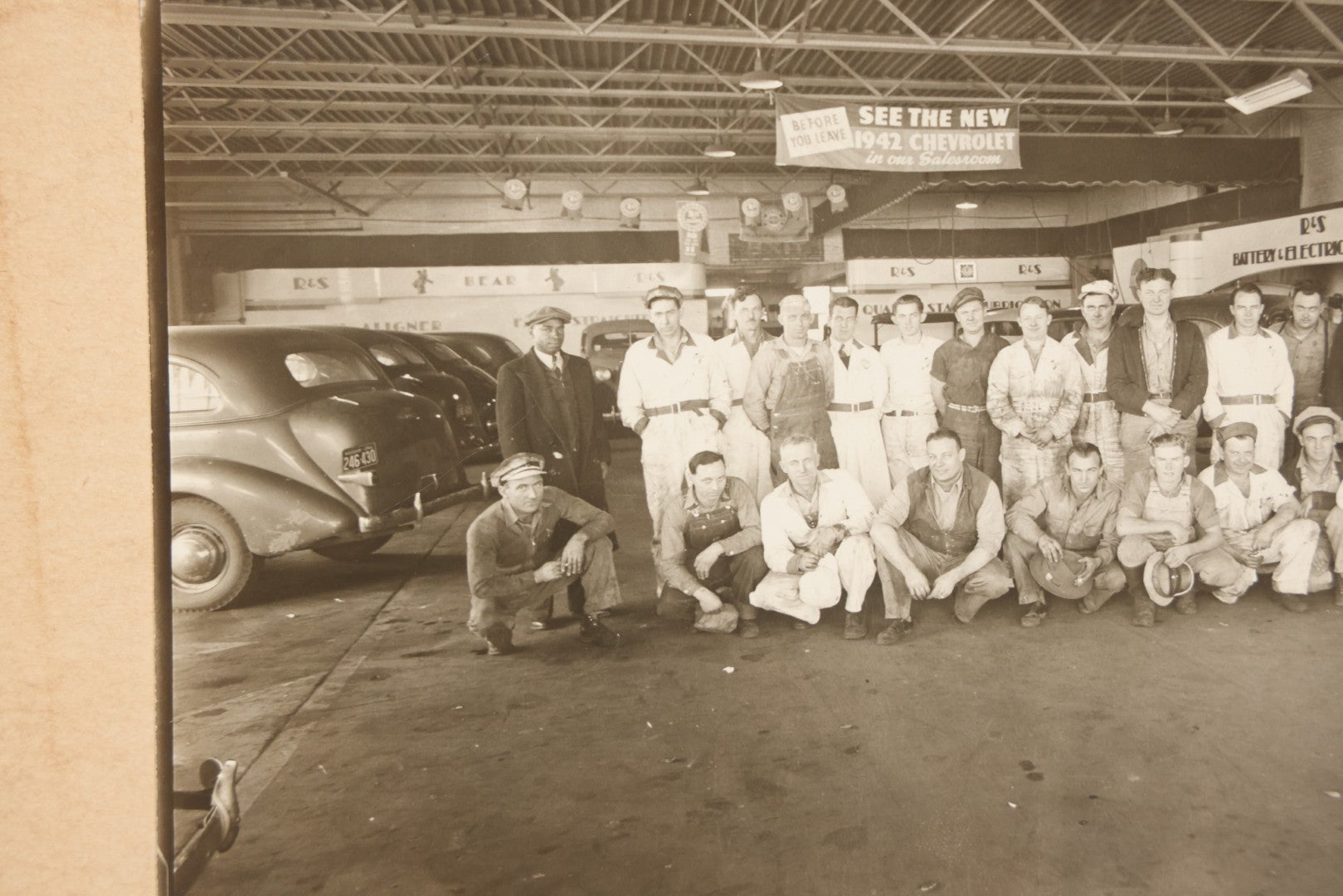 Lot 145 - Vintage Boarded Occupational Photograph Of Mechanics And Workers At A Chevrolet Dealership And Sales Room, Photo Taken On November 13, 1941, Photographed On Eastman Kodak Safety Film