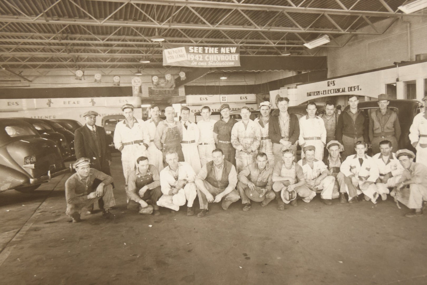 Lot 145 - Vintage Boarded Occupational Photograph Of Mechanics And Workers At A Chevrolet Dealership And Sales Room, Photo Taken On November 13, 1941, Photographed On Eastman Kodak Safety Film