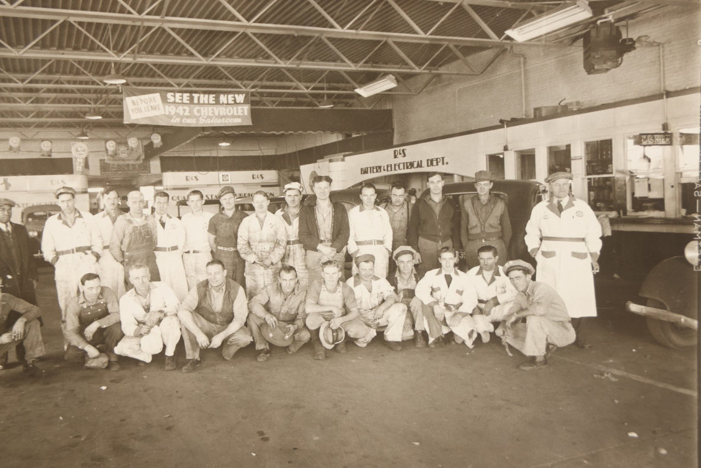 Lot 145 - Vintage Boarded Occupational Photograph Of Mechanics And Workers At A Chevrolet Dealership And Sales Room, Photo Taken On November 13, 1941, Photographed On Eastman Kodak Safety Film