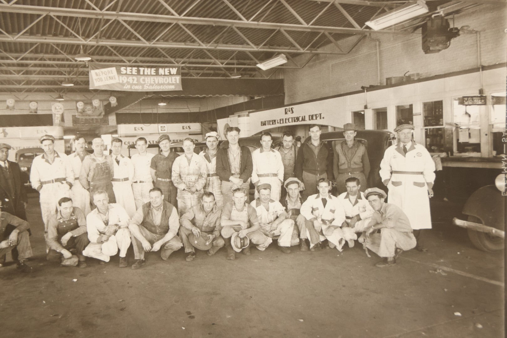 Lot 145 - Vintage Boarded Occupational Photograph Of Mechanics And Workers At A Chevrolet Dealership And Sales Room, Photo Taken On November 13, 1941, Photographed On Eastman Kodak Safety Film